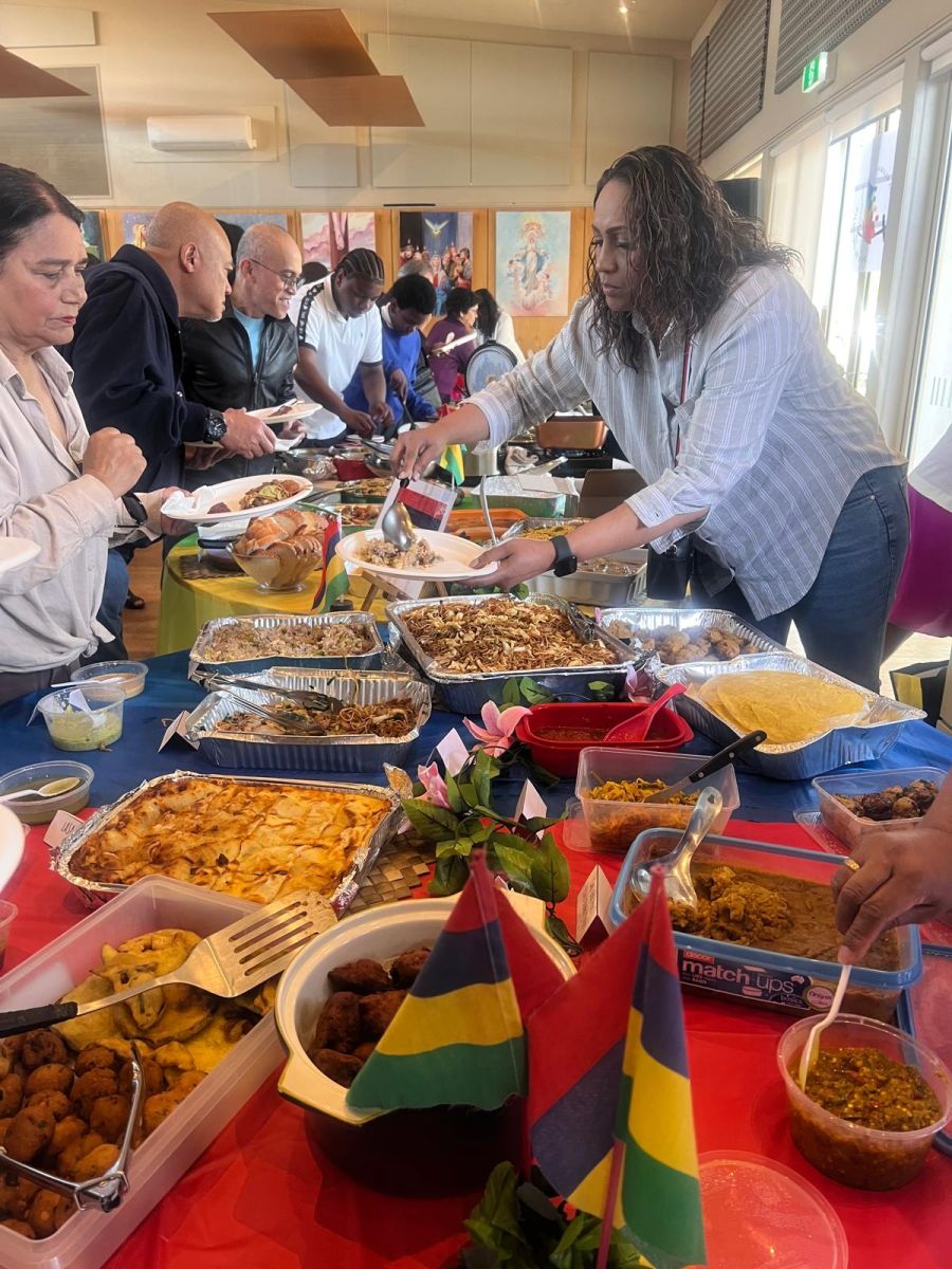 People sharing food at a community lunch