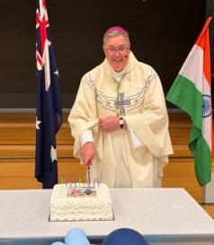 Bishop cutting the cake